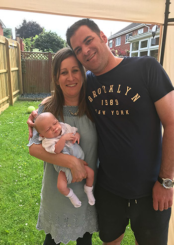 Happy family with newborn