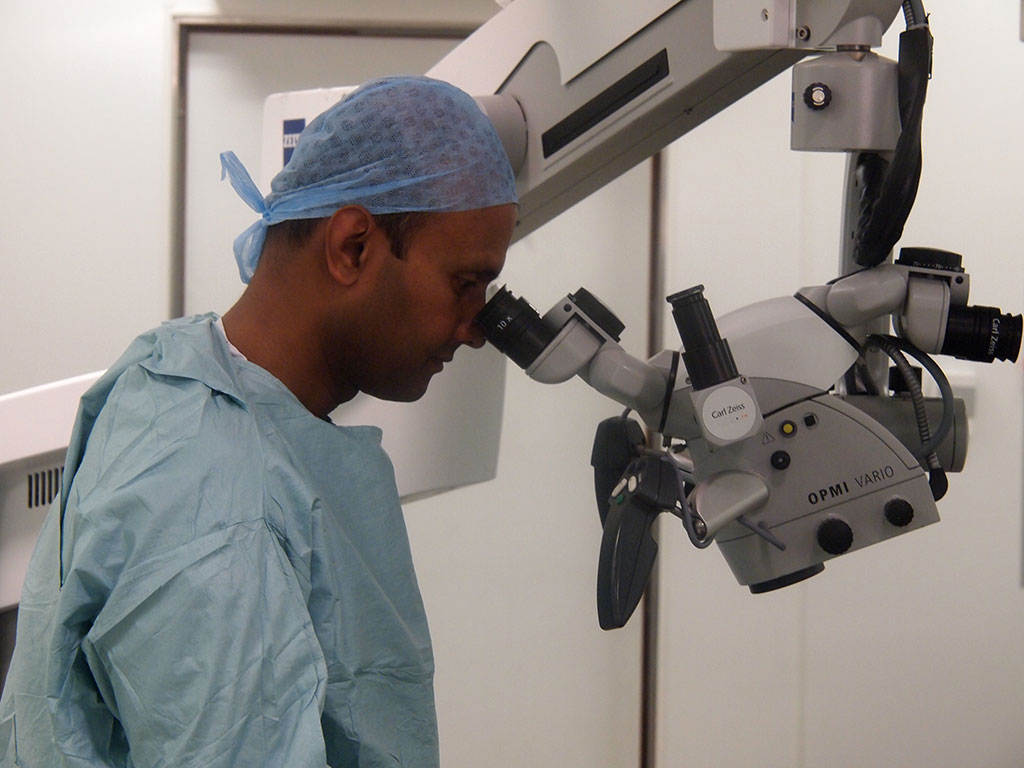 Mr Thiruchelvam performing microsurgery